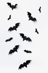 Wall Mural - halloween and decoration concept - paper bats flying