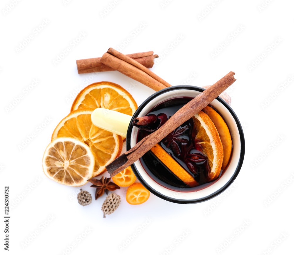 Metal cup of delicious mulled wine on white background