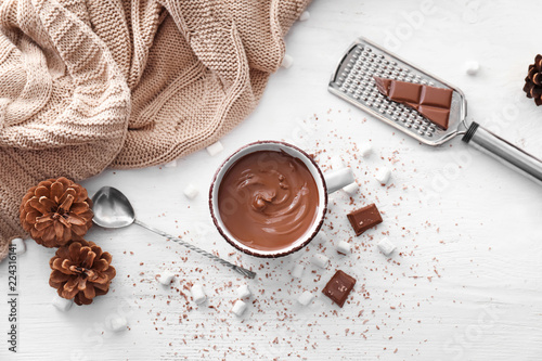 Fotomural Cup of hot chocolate on light table