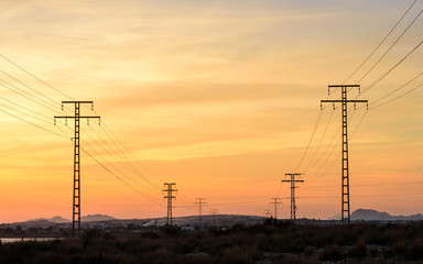 High voltage power lines at sunset