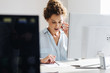 © LStockStudio - Businesswoman Working on a Desktop Computer