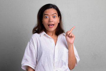 Portrait of young beautiful Asian woman with short hair