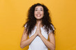 Young cute woman posing isolated over yellow background showing hopeful please gesture.