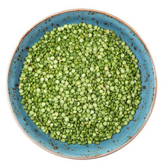 Canvas Print - dried uncooked green peas on a plate isolated