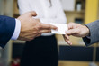 Closeup of businesspeople exchanging business card