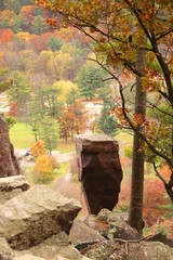 Wall Mural - wisconsin ice age nature background. autumn landscape with balanced rock on south shore hiking trail