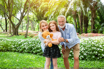 Happy family relaxing and smile in the park