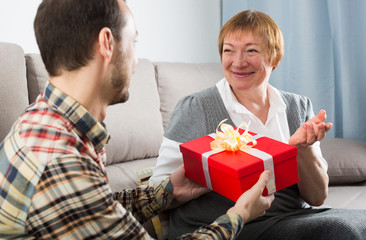 Son giving present to mother