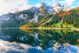 Fototapeta Natura - autumn scenery with Dachstein mountain summit reflecting in crystal clear Gosausee mountain lake