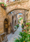Fototapeta Na drzwi - Scenic sight in Spello, flowery and picturesque village in Umbria, province of Perugia, Italy.