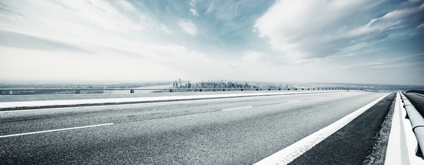 Canvas Print - empty highway through modern city