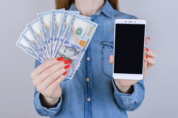 Loan touchscreen screen interface touch people person gift fan bill jeans shirt store win transaction transfer  usa buy customer concept. Close up portrait of lady with cash isolated background