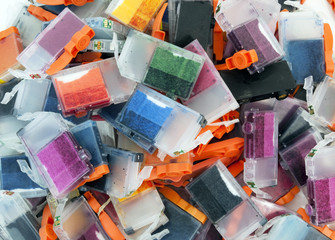 Wall Mural - Empty inkjet color cartridges on white background.