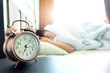 © Photo Sesaon - Man sleeping in a bedroom holiday. Morning alarm clock concept Health