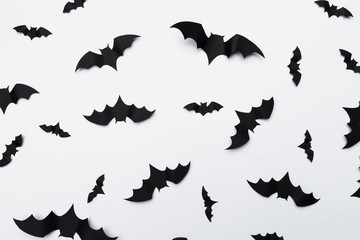 Wall Mural - halloween and decoration concept - paper bats flying