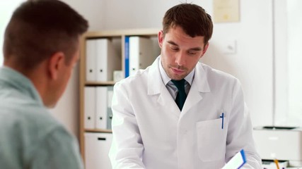 Sticker - medicine, healthcare and people concept - doctor showing cardiogram to male patient at hospital