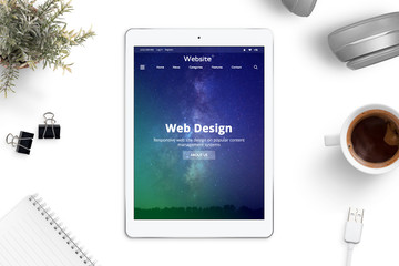 Aufkleber - Web site of web desing company on tablet screen. Top view composition on office desk.