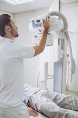 Wall Mural - Technician Operating an X-ray Machine