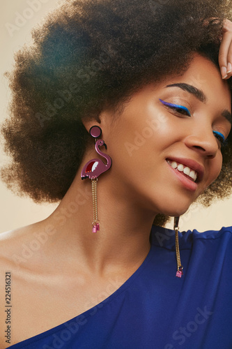 A Close Up Portrait Of A Young African Lady With Short Curly Hair