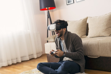 Man playing a virtual reality game game