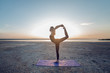 © fotoplaton - Girl practicing yoga at dawn
