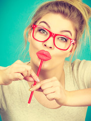 Poster - Happy woman holding fake lips on stick