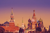Fototapeta Londyn - View on Spasskaya Tower and Saint Basil's Cathedral at Red Square of the Moscow Kremlin, Moscow, Russia. Toned image