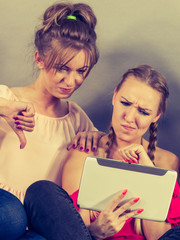 Two women using tablet