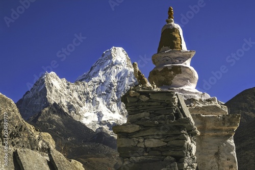 фотография Buddhist Stupa Statue and Distant Ama Dablam Peak in Nepal Himalaya Mountains du