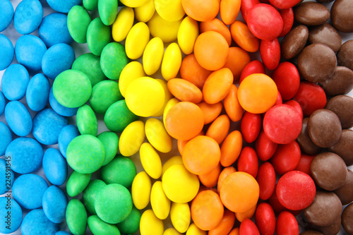Plakat Many colorful candies as background, top view