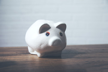 Piggy bank on wooden table