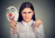 Angry woman with clown mask