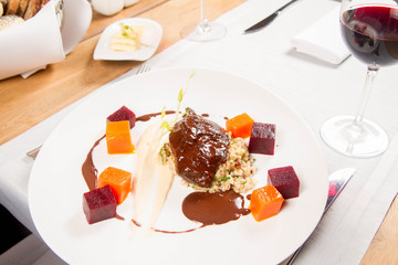 Sticker - Beef cheeks with vegetables, roasted parsley root mousse , pearl barley, dark chocolate and demi glace sauce