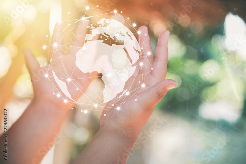 Fotografie, Obraz hand holding flying earth network global connection concept