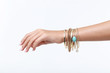 © 5second - Female hand with bracelets on white background
