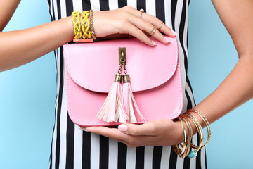 Wall Mural - Woman with handbag and bracelets on hands