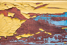 Old Peeling Paint On The Board. Blue And Orange Background.