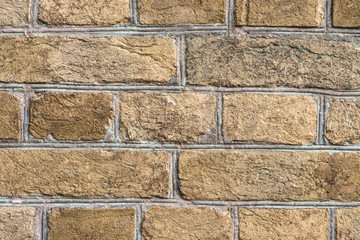 brown grungy brick wall with sunlight