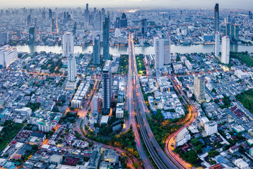 Fototapete - Aerial view of Bangkok skyline panorama and skyscraper with light trails on Sathorn Road center of business in Bangkok city Thailand.