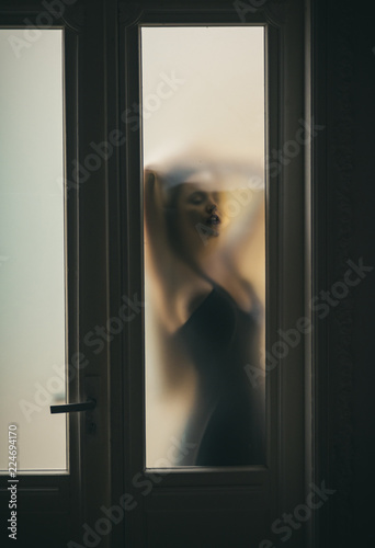 Fotografie, Obraz Blur woman silhouette in mysterious mood. Guess my mood today