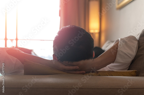 Fotografie, Obraz .Good life and easy relax business man lifestyle after work at hotel sitting han