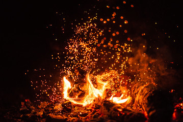 Fiery fire isolated on black isolated background . Beautiful yellow, orange and red fire flame texture style.