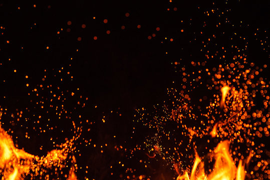 fiery fire isolated on black isolated background . beautiful yellow, orange and red fire flame textu