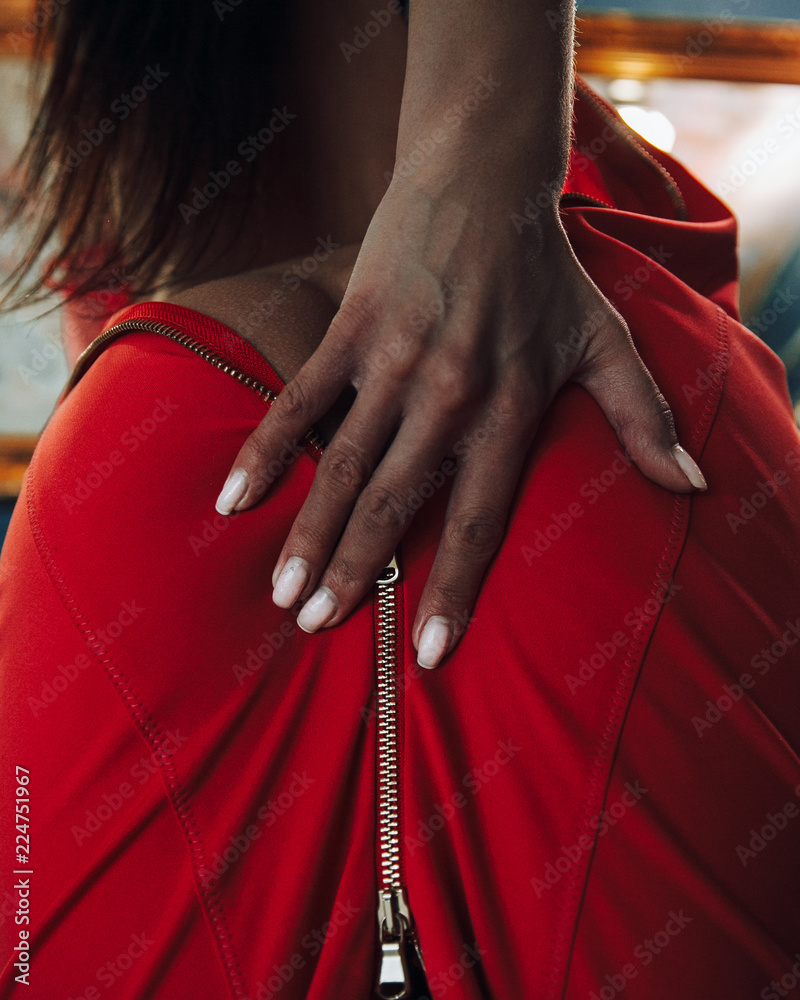 Sexy girl in red dress.A girl with a beautiful booty.Girl in the