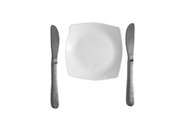 Two Knives and a white plate