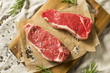 © Brent Hofacker - Raw Grass Fed NY Strip Steaks