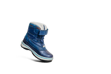 Blue children's shoe on a white, isolated background. The concept of upcoming cold, selling shoes. Warm, comfortable shoe for children with fur at an angle and inclination.