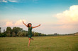 © Marko - Beautiful young woman running on a meadow at sunset
