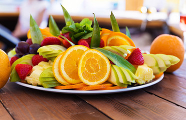 Wall Mural - Party plate with fresh fruit cuts on table