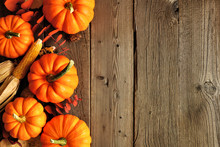 Autumn Side Border Of Pumpkins And Fall Decor On A Rustic Wood Background With Copy Space